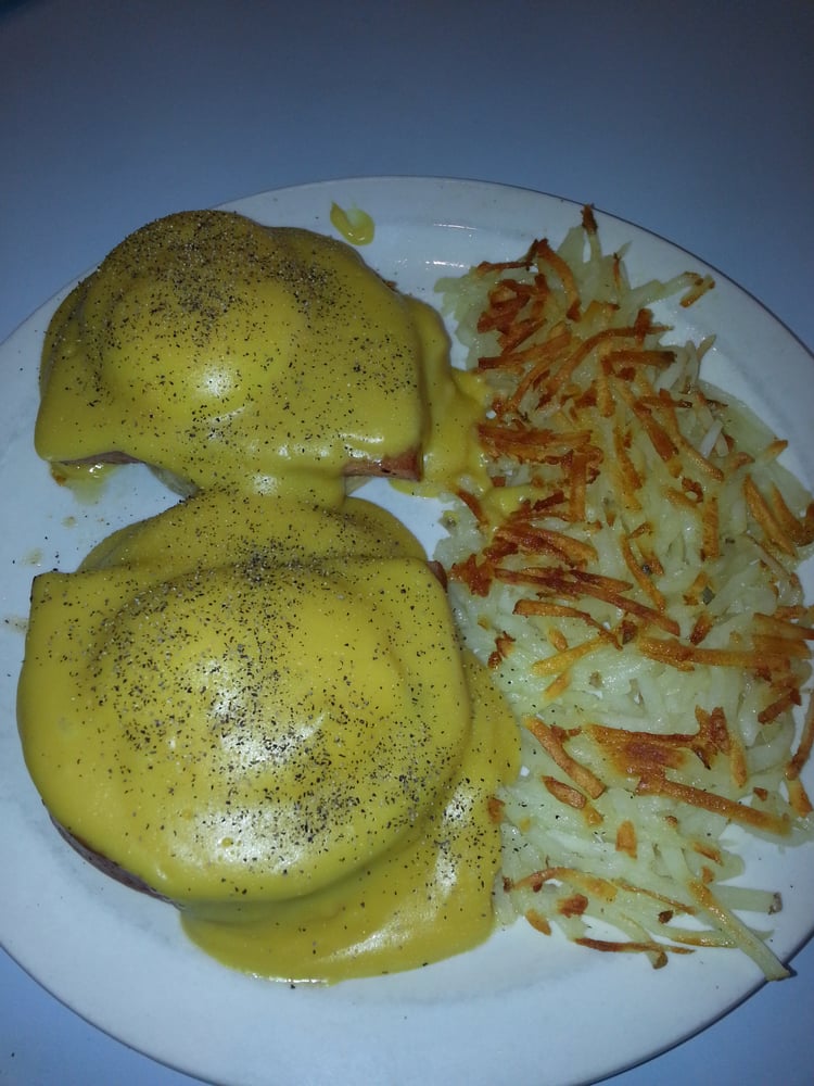Eggs Benedict on an English muffin with hollandaise